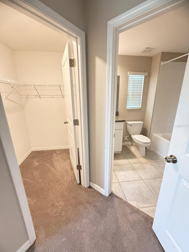 full bathroom featuring vanity, tile patterned flooring, toilet, and tub / shower combination