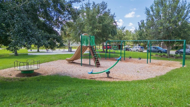 view of jungle gym with a lawn