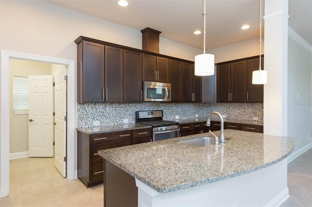 kitchen with sink, stainless steel appliances, backsplash, and light tile patterned floors