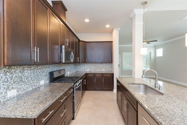 kitchen featuring tasteful backsplash, ceiling fan, stainless steel appliances, ornamental molding, and sink