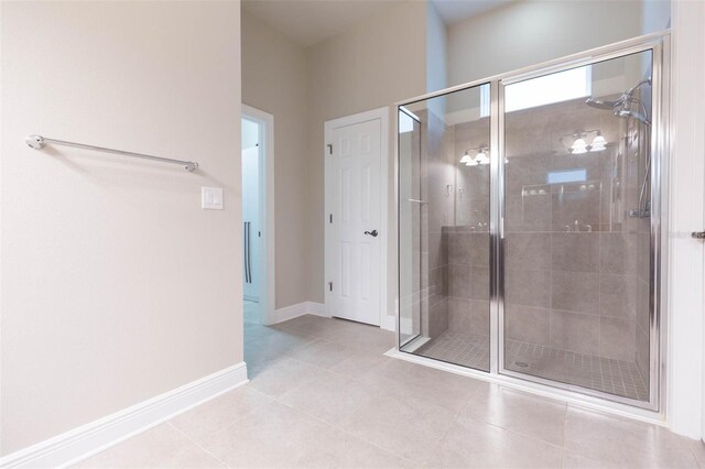 bathroom featuring tile patterned floors and an enclosed shower