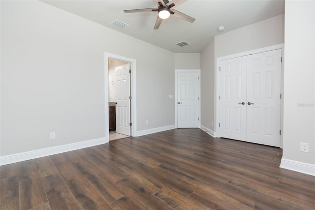 unfurnished bedroom with a closet, hardwood / wood-style floors, and ceiling fan