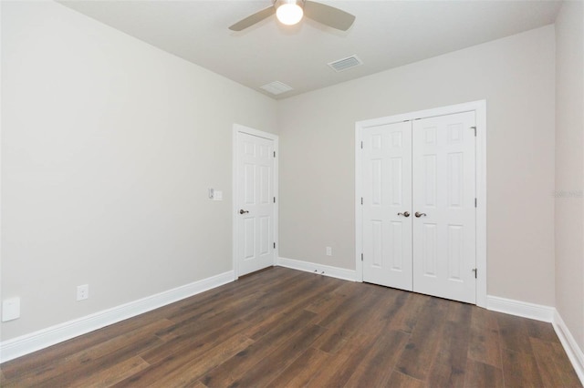 unfurnished bedroom featuring hardwood / wood-style flooring, a closet, and ceiling fan