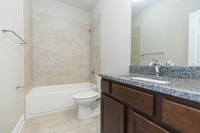 full bathroom featuring tile patterned floors, vanity, tiled shower / bath combo, and toilet