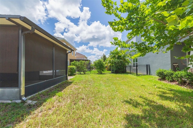 view of yard with a sunroom