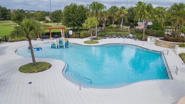 view of swimming pool featuring a pergola and a patio area