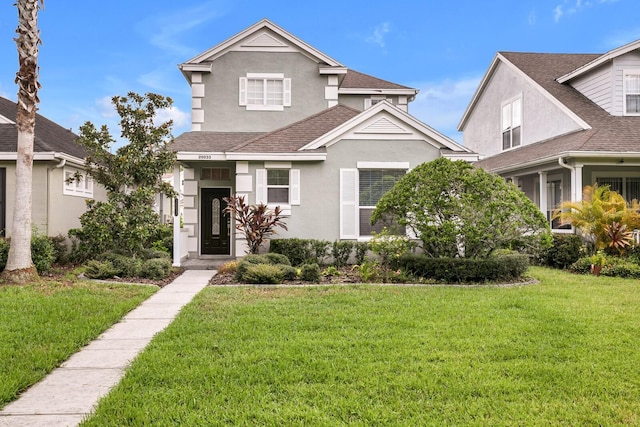 front of property featuring a front lawn