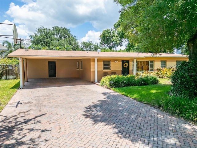 single story home featuring a carport