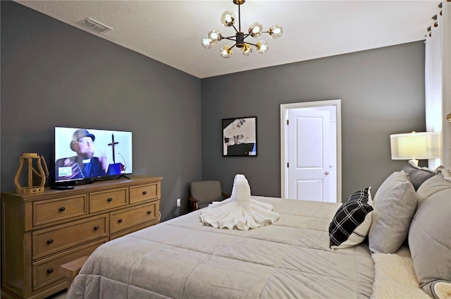 bedroom with an inviting chandelier