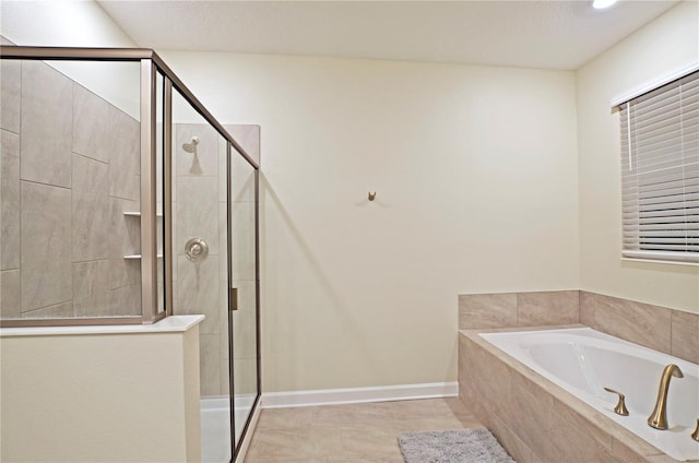 bathroom with plus walk in shower and tile patterned floors