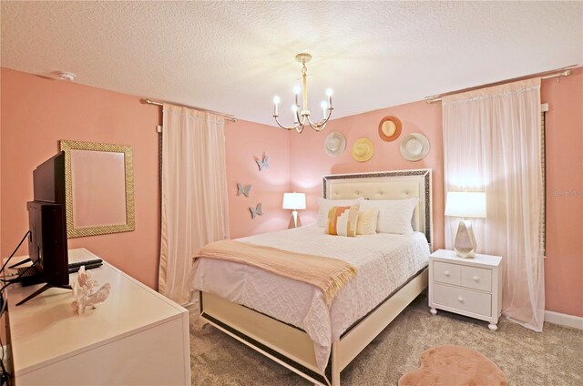 2857 Bookmark Dr, Kissimmee, FL 34746 - bedroom with a textured ceiling, an inviting chandelier, and light carpet