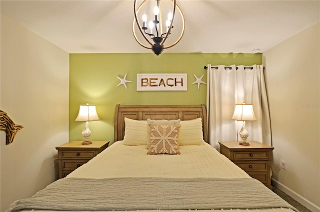 carpeted bedroom with a chandelier