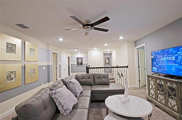 carpeted living room featuring ceiling fan