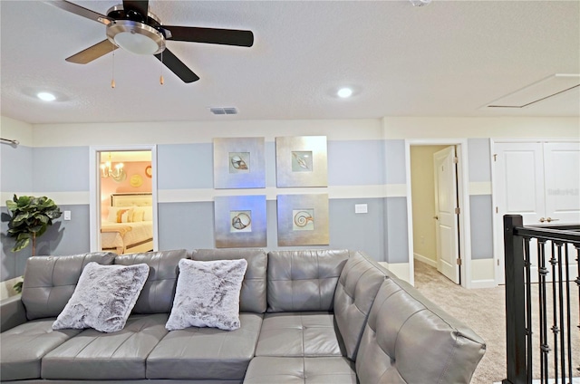 carpeted living room featuring ceiling fan