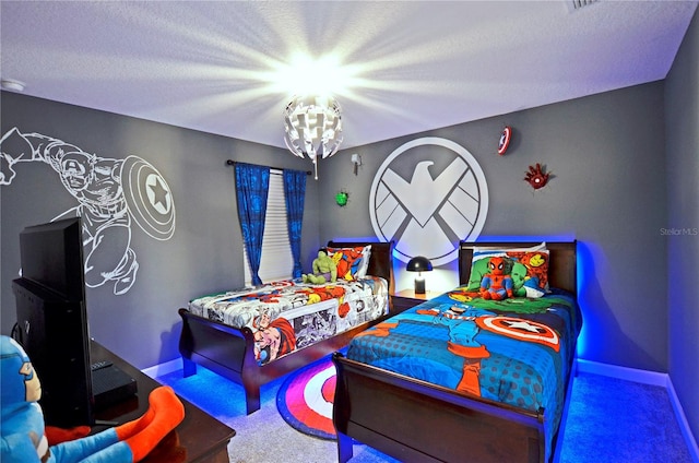 carpeted bedroom with a textured ceiling and an inviting chandelier