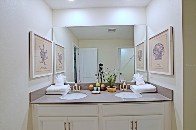 2857 Bookmark Dr, Kissimmee, FL 34746 - full bath with double vanity, visible vents, and a sink