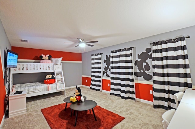 bedroom featuring light carpet and ceiling fan