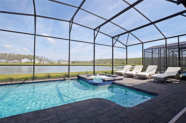 view of pool with a patio, an in ground hot tub, and glass enclosure