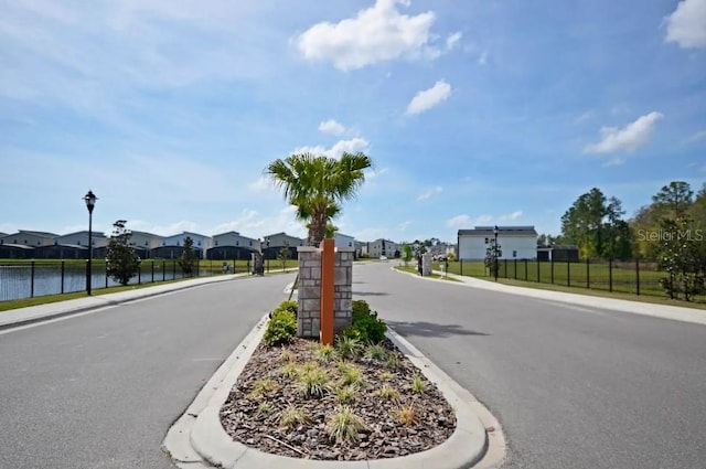 2857 Bookmark Dr, Kissimmee, FL 34746 - view of road with street lights, sidewalks, curbs, and a residential view