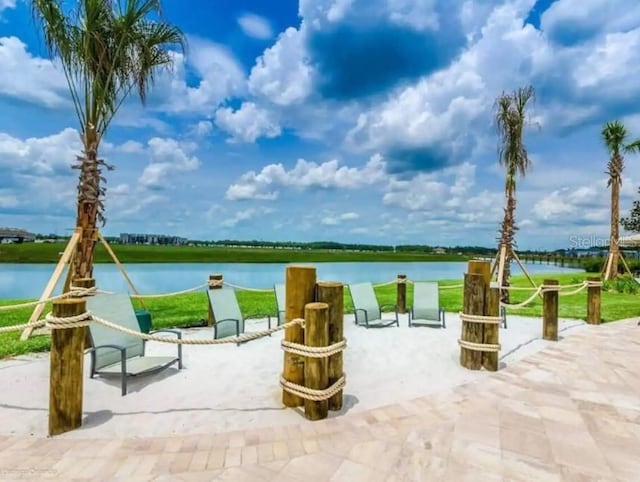 view of patio featuring a water view