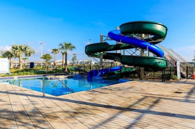 2857 Bookmark Dr, Kissimmee, FL 34746 - community pool with fence and a water slide