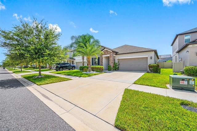 view of front of home with a garage and a front lawn