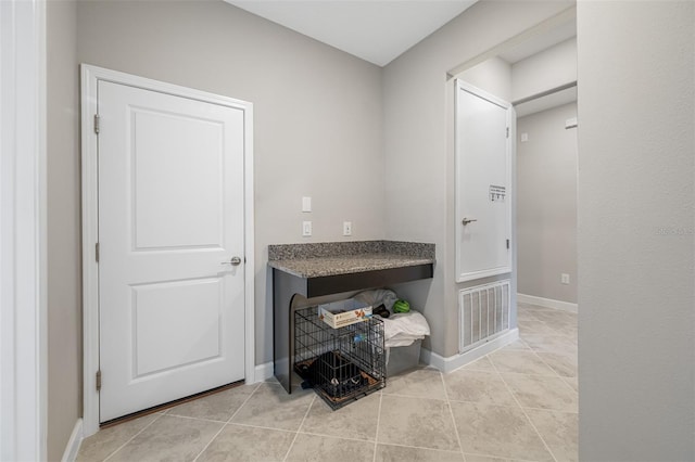 interior space featuring light tile patterned floors