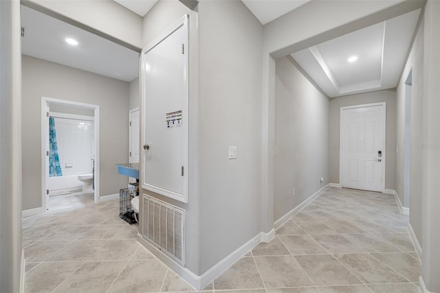 hallway with light tile patterned flooring