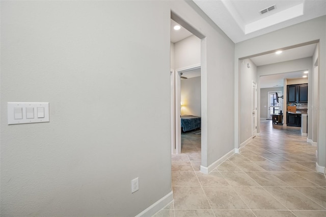 hall with light tile patterned flooring