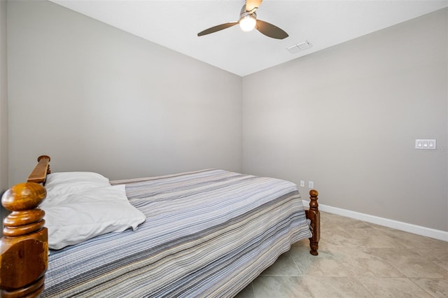 bedroom with tile patterned flooring and ceiling fan