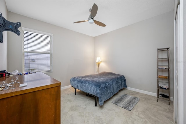 bedroom featuring light tile patterned floors and ceiling fan