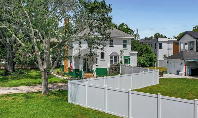 view of front of home with a front lawn