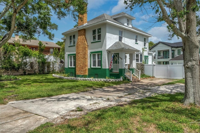 view of front of property with a front lawn