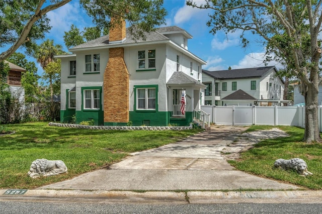 view of front of property with a front lawn