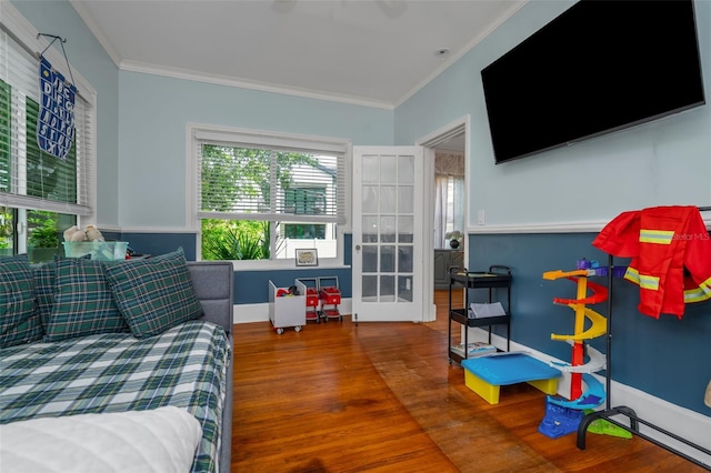 bedroom featuring crown molding and hardwood / wood-style floors