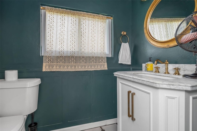 bathroom with toilet and vanity