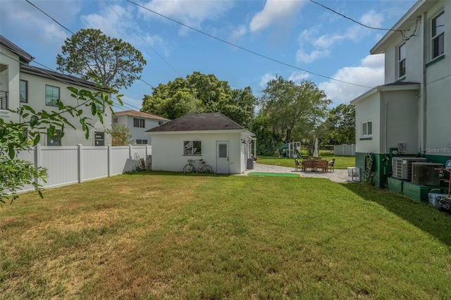 view of yard featuring cooling unit and a patio