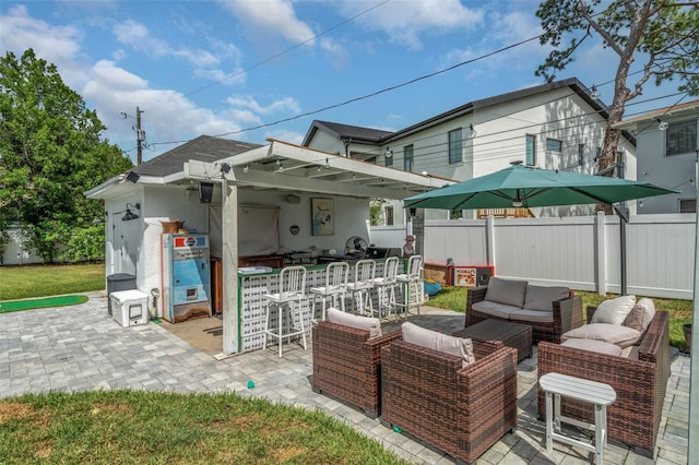 view of patio featuring a bar and an outdoor living space