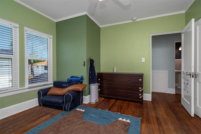 sitting room with dark wood-type flooring and ornamental molding