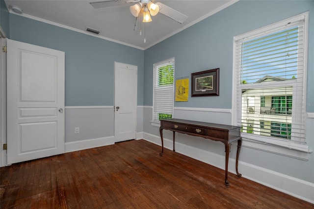 interior space with ceiling fan, dark hardwood / wood-style flooring, and crown molding