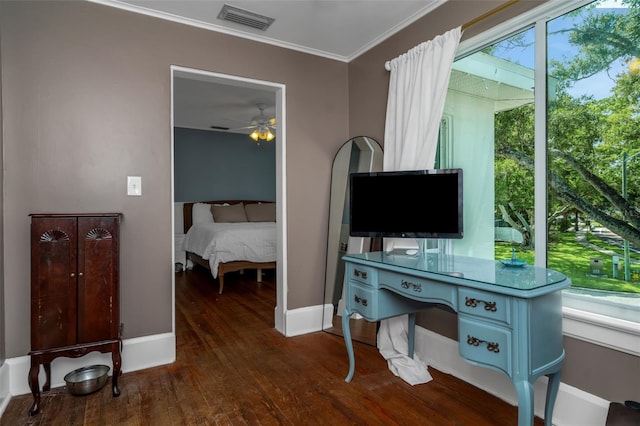 office featuring ceiling fan, ornamental molding, and dark hardwood / wood-style floors