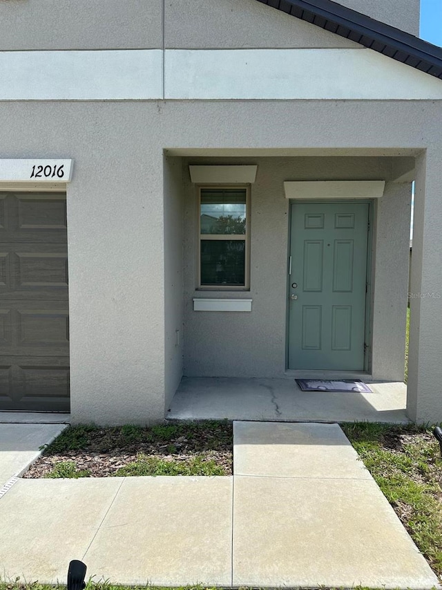 property entrance with a garage