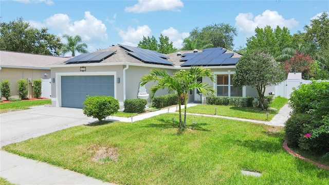 single story home featuring a garage, a front lawn, and solar panels