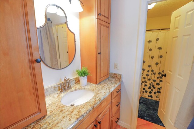 bathroom with vanity and tile patterned flooring