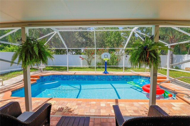 view of pool featuring a lanai and a patio