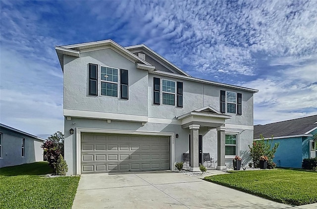 front facade with a front lawn and a garage