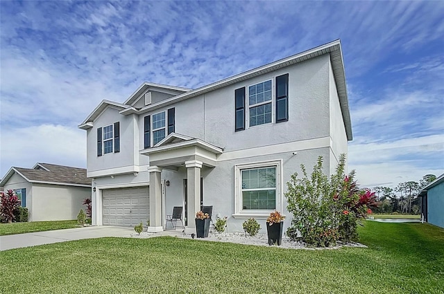 view of front of property with a front lawn and a garage