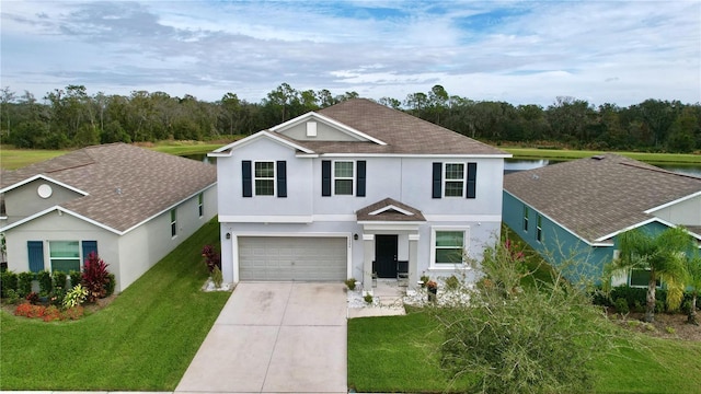 view of front of home featuring a garage and a front yard