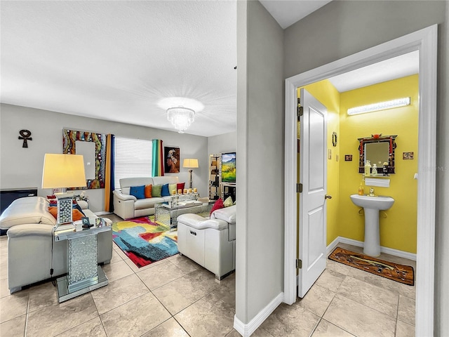 tiled living room featuring sink