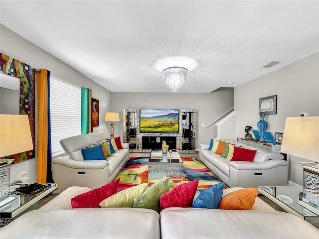 living room featuring an inviting chandelier